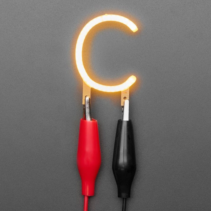 Alphabet LED Filament - This warm-white glowy letter is made out of COB (chip on board) LEDs, often seen in 'Edison-like' LED bulbs, arranged in different patterns to give a bright, warm lighting effect.