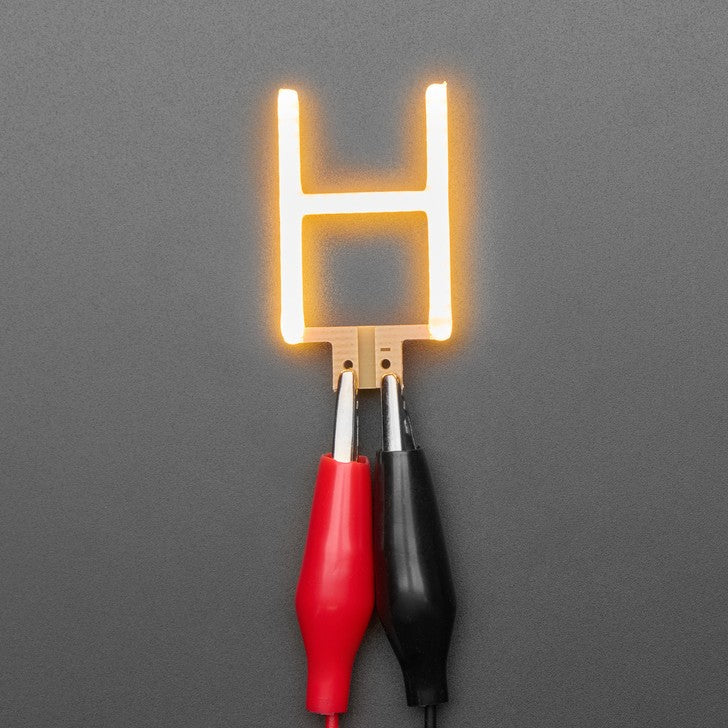 Alphabet LED Filament - This warm-white glowy letter is made out of COB (chip on board) LEDs, often seen in 'Edison-like' LED bulbs, arranged in different patterns to give a bright, warm lighting effect.