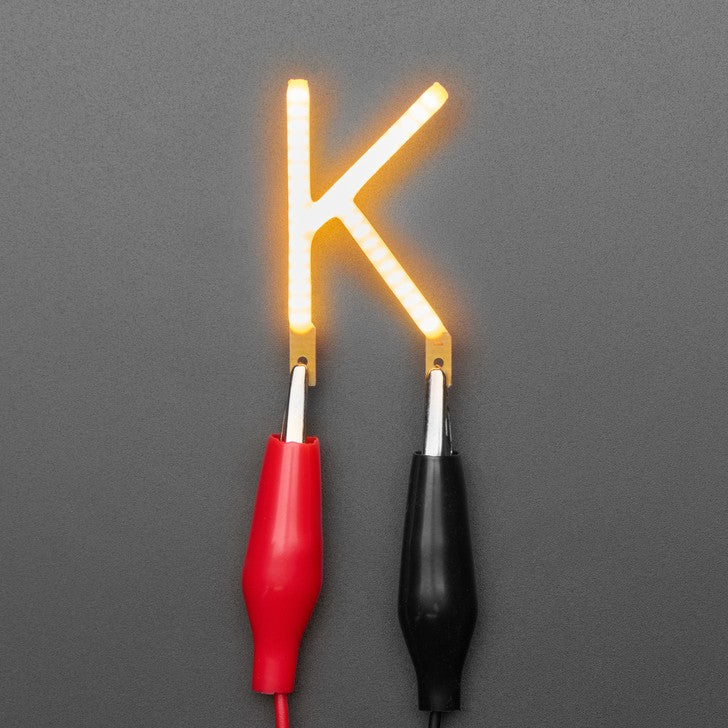 Alphabet LED Filament - This warm-white glowy letter is made out of COB (chip on board) LEDs, often seen in 'Edison-like' LED bulbs, arranged in different patterns to give a bright, warm lighting effect.