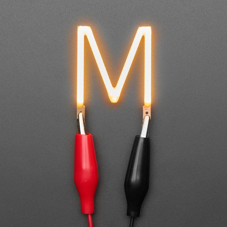 Alphabet LED Filament - This warm-white glowy letter is made out of COB (chip on board) LEDs, often seen in 'Edison-like' LED bulbs, arranged in different patterns to give a bright, warm lighting effect.