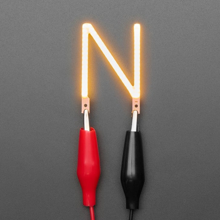 Alphabet LED Filament - This warm-white glowy letter is made out of COB (chip on board) LEDs, often seen in 'Edison-like' LED bulbs, arranged in different patterns to give a bright, warm lighting effect.