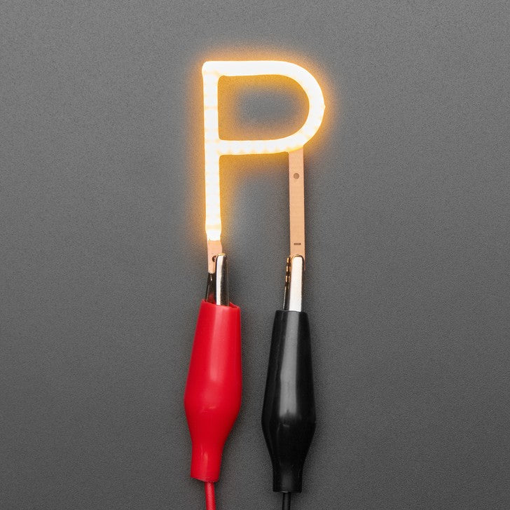Alphabet LED Filament - This warm-white glowy letter is made out of COB (chip on board) LEDs, often seen in 'Edison-like' LED bulbs, arranged in different patterns to give a bright, warm lighting effect.