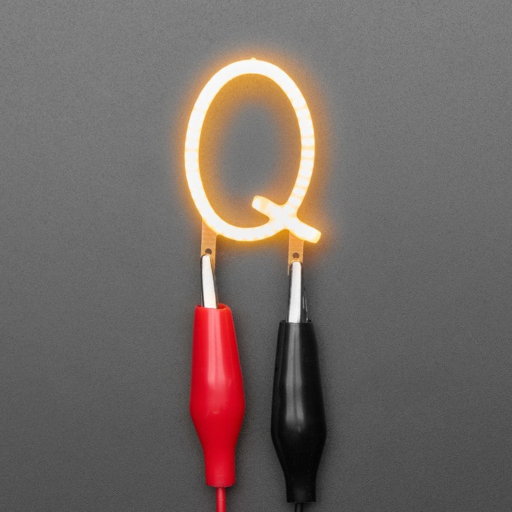 Alphabet LED Filament - This warm-white glowy letter is made out of COB (chip on board) LEDs, often seen in 'Edison-like' LED bulbs, arranged in different patterns to give a bright, warm lighting effect.
