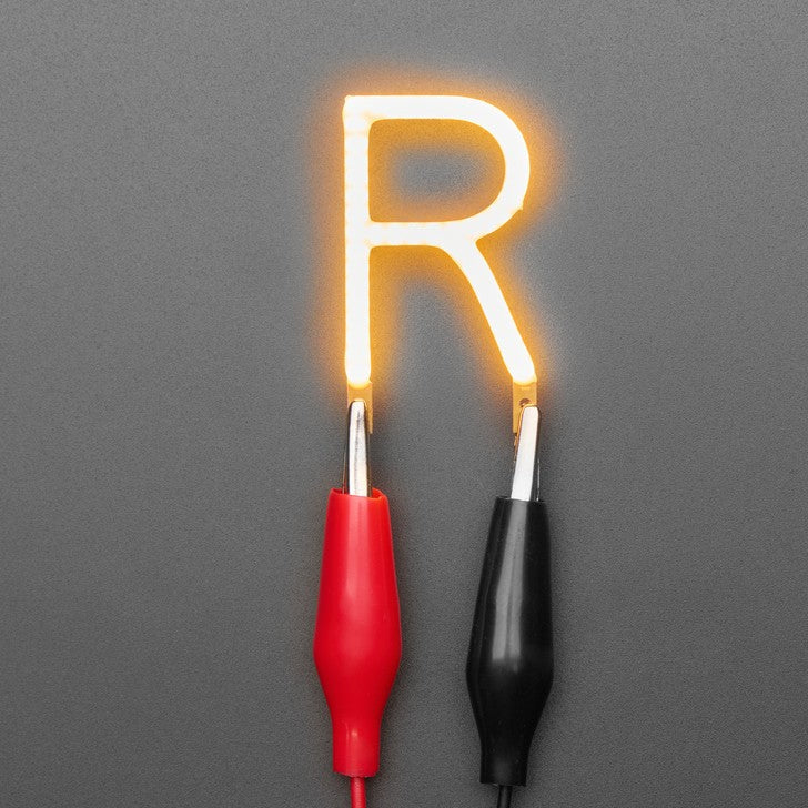 Alphabet LED Filament - This warm-white glowy letter is made out of COB (chip on board) LEDs, often seen in 'Edison-like' LED bulbs, arranged in different patterns to give a bright, warm lighting effect.