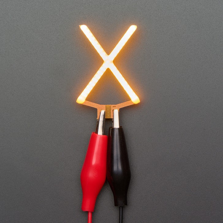 Alphabet LED Filament - This warm-white glowy letter is made out of COB (chip on board) LEDs, often seen in 'Edison-like' LED bulbs, arranged in different patterns to give a bright, warm lighting effect.