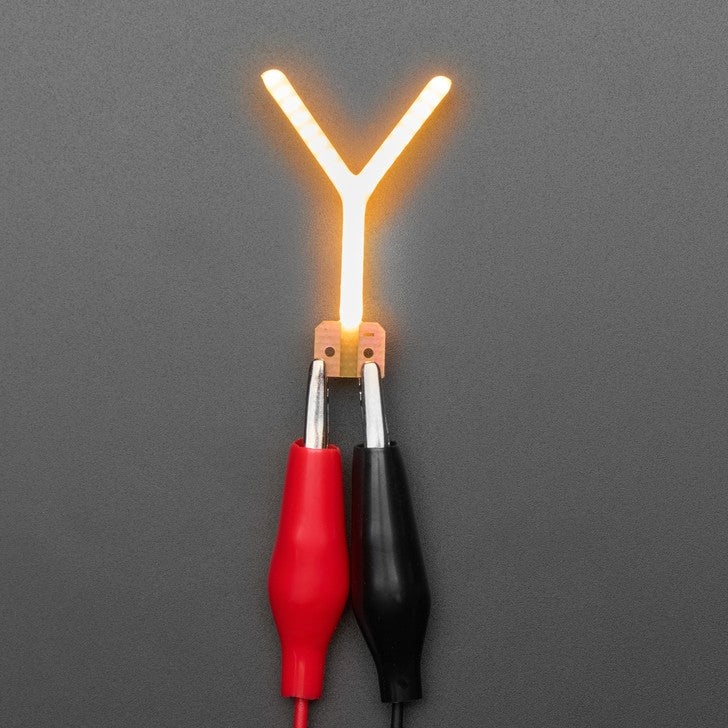 Alphabet LED Filament - This warm-white glowy letter is made out of COB (chip on board) LEDs, often seen in 'Edison-like' LED bulbs, arranged in different patterns to give a bright, warm lighting effect.