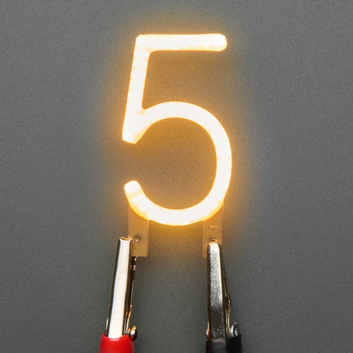 Number LED Filament - This warm-white glowy number is made out of COB (chip on board) LEDs, often seen in 'Edison-like' LED bulbs, arranged in different patterns to give a bright, warm lighting effect.