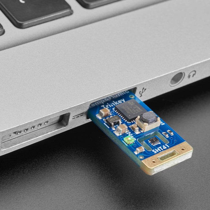 Adafruit SHT41 Trinkey - USB Temperature and Humidity Sensor - It's half USB Key, half temperature-humidity sensor... it's the Adafruit SHT41 Trinkey. We wanted to make it super-easy to add one of our most popular combination environmental sensors to any computer with a USB A port.
