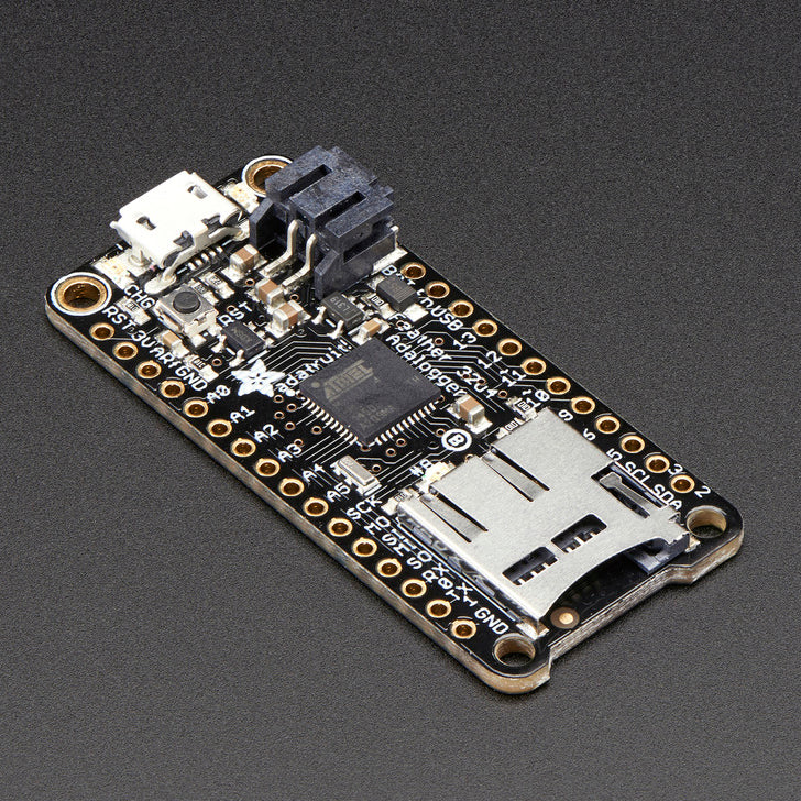 Adafruit Feather 32u4 Adalogger - This is the Adafruit Feather 32u4 Adalogger - Adafruit's take on an 'all-in-one' datalogger (or data-reader) with built in USB and battery charging. Its an Adafruit Feather 32u4 with a microSD holder ready to rock!