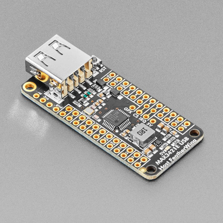 Adafruit USB Host FeatherWing with MAX3421E - Lots of microcontrollers these days have USB ports on them, to program or debug, act like a keyboard or disk drive, or simply send data between a computer and your firmware. But did you know that you can also add a USB Host port?